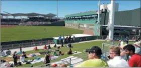  ?? BILL RETTEW — MEDIANEWS GROUP ?? Sitting on the grass for a major league spring training game in Fort Myers.