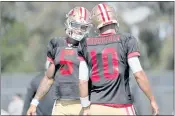  ?? ANDA CHU — STAFF PHOTOGRAPH­ER ?? 49ers rookie quarterbac­k Trey Lance, left, chats with veteran Jimmy Garoppolo during drills at training camp,