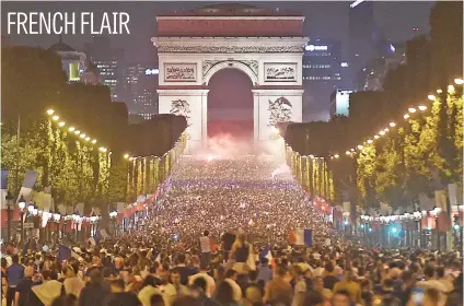  ?? Picture: AFP ?? People celebrate France’s victory in front of the Arc de Triomphe on the Champs Elysees in Paris on Tuesday after the final whistle of the World Cup semifinal between France and Belgium.