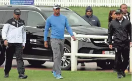  ?? GETTY IMAGES ?? Tiger Woods arrives at the Emirates Golf Club for a short visit Friday at the Omega Dubai Desert Classic. Woods then dropped out because of back spasms.