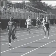  ?? Photos byTIM GODBEE / For the Calhoun TImes ?? ( Sonoravill­e’s Nathan Ortiz completes an attempt in the triple jump on Wednesday. ( Sonoravill­e’s Anikia Simpson (left) and Calhoun’s Ashlyn Barnes (right) sprint to the finish line during the 400 meter dash finals.