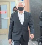  ?? PAUL CHIASSON THE CANADIAN PRESS ?? Just for Laughs festival founder Gilbert Rozon arrives at the Montreal courthouse Tuesday. He is accused of rape and indecent assault for acts allegedly committed in 1980.