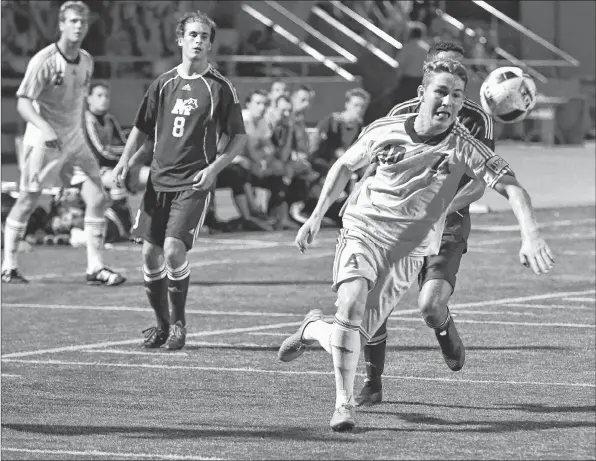  ?? PETER OLESKEVICH ?? Cooper Coats plays for Acadia in a game against Saint Mary’s last fall. After graduation, the men’s soccer player will switch sports and take a position on the national men’s rugby team.