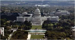  ?? Associated Press ?? ■ The U.S. Capitol building is seen from the Washington Monument in Washington. The federal deficit for the 2019 budget year is expected to have soared to near $1 trillion, up more than $200 billion from last year and the largest such gap in seven years.