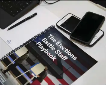  ?? Associated Press ?? In this Dec. 16 photo, the Battle Staff Playbook is seen on the table during an exercise run by military and national security officials, for state and local election officials to simulate different scenarios for the 2020 elections Dec. 16 in Springfiel­d, Va.