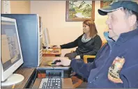  ?? ERIC MCCARTHY/TC MEDIA ?? Lynn Dorgan, left, and Ronnie Gaudet do their part at the Tignish Cultural Centre to help O’Leary win the title of Kraft Hockeyvill­e. Voting continued until 1 a.m. Tuesday.