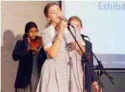  ??  ?? St Paul’s year nine music students Lottie Brandon (front) and Tanvi Atla (violin) entertain the audience.