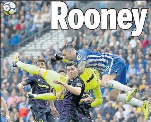  ?? AFP/GETTY IMAGES ?? Brighton defender Shane Duffy (right) gets caught up with Everton’s goalkeeper Jordan Pickford (centre) as Everton’s defender Michael Keane (front) looks on during their English Premier League match in Brighton yesterday.