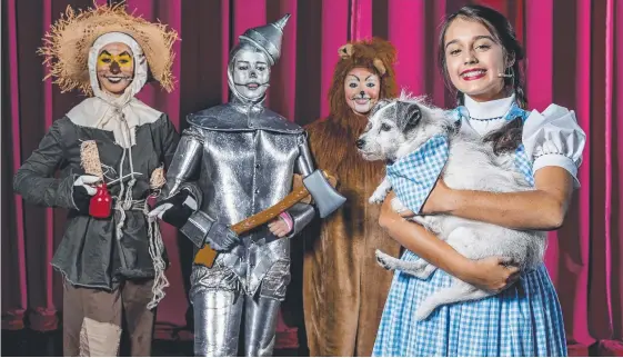  ?? Picture: JERAD WILLIAMS ?? St Hilda’s has spared no expense in its production of The Wizard of Oz (Tinman), Stephanie Nickel (Lion) and Tasha Sheppard (Dorothy). with a cast of 160 students and starring Chiara Linnane (Scarecrow), Daria Chernova