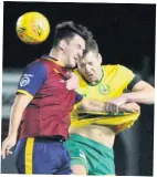  ??  ?? ● Caernarfon’s Gareth Edwards wins this aerial battle against Cardiff Mets