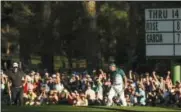  ?? MATT SLOCUM — THE ASSOCIATED PRESS FILE ?? In this April 9photo, Sergio Garcia, of Spain, right, reacts after putting in for an eagle on the 15th hole during the final round of the Masters golf tournament, in Augusta, Ga. Garcia hit 8-iron to the green, the most memorable shot with that club...