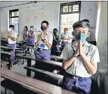  ?? REUTERS ?? Students pray inside their classroom following the reopening of schools in Gujarat on February 18, 2021.