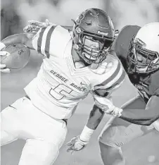  ?? Thomas B. Shea ?? George Ranch’s Alex Fontenot, left, tries to shake off an attempted tackle by a Pearland defender in the first half of Friday night’s game at The Rig.