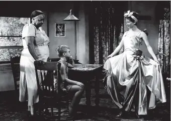  ??  ?? Ethel Waters, Brandon de Wilde, and Julie Harris in The Member of the Wedding, based on the novel by Carson McCullers, 1952