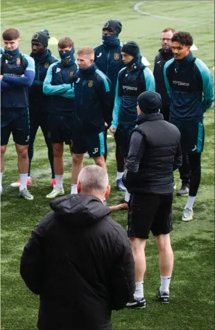  ?? ?? Livingston manager David Martindale ( right) addresses his squad and staff during training at the Tony Macaroni Arena