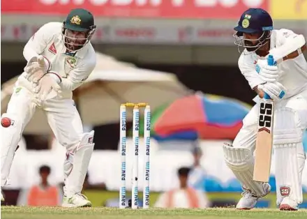  ?? AFP PIC ?? India’s Lokesh Rahul (right) plays a shot past Australian wicketkeep­er Matthew Wade on the second day of the third Test in Ranchi yesterday.