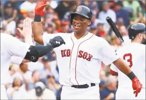  ?? Maddie Meyer / Getty Images ?? Rafael Devers of the Red Sox celebrates after hitting a two-run home run in the third inning of Sunday’s game against the Astros at Fenway Park in Boston.