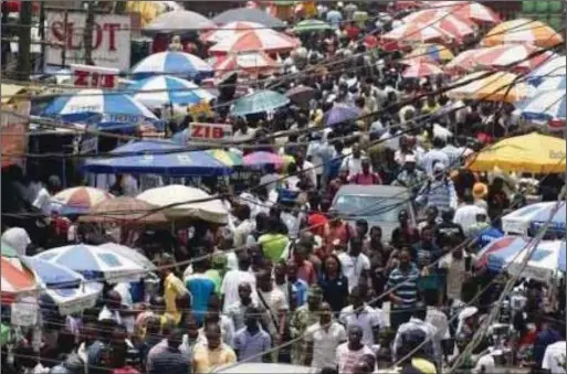  ??  ?? Traders and customers struggling for space at Ikeja Computer Village