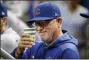  ?? GENE J. PUSKAR — THE ASSOCIATED PRESS ?? Chicago Cubs manager Joe Maddon salutes a fan from the dugout before a baseball game against the Pittsburgh Pirates in Pittsburgh, Wednesday.