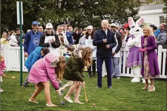  ?? Drew Angerer / Getty Images ?? President Joe Biden and first lady Jill Biden attend the Easter Egg Roll on the South Lawn of the White House on Monday. The Easter Egg Roll tradition returned this year after being canceled in 2020 and 2021 due to the COVID-19 pandemic.