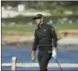  ?? ERIC RISBERG — THE ASSOCIATED PRESS ?? Dustin Johnson follows his shot from the seventh tee of the Pebble Beach Golf Links during the third round of the AT&T Pebble Beach National Pro-Am golf tournament Saturday in Pebble Beach