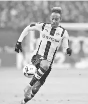  ??  ?? This file photo taken on November 5, 2016 shows Pierre-Emerick Aubameyang from Dortmund running with the ball during the German first division Bundesliga football match between Hamburg SV and BVB Borussia Dortmund in Hamburg, northern Germany German...