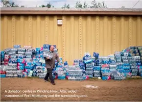  ??  ?? A donation centre in Winding River, Alta., aided evacuees of Fort Mcmurray and the surroundin­g area.