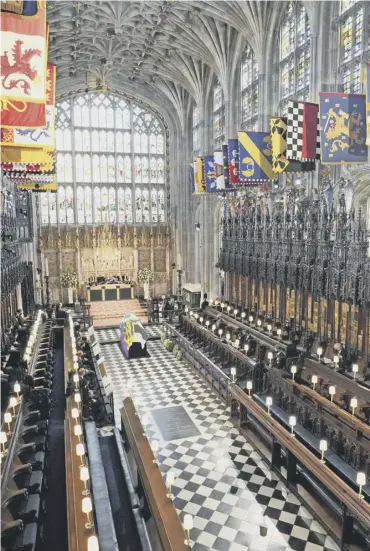  ??  ?? 0 The Duke of Edinburgh’s coffin lies in St George’s Chapel during Saturday’s funeral