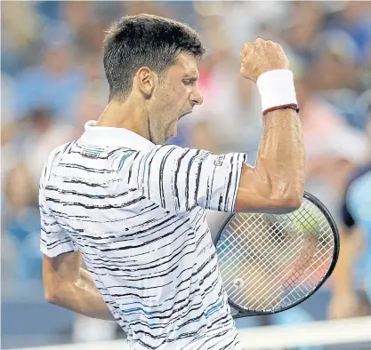  ??  ?? Novak Djokovic of Serbia celebrates a point against Pablo Carreno Busta of Spain during their match.