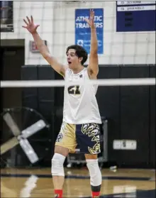  ?? Photos by Habeba Mostafa/ The Signal ?? (Left) West Ranch middle blocker Lucas Reuter (12) goes for the kill against Golden Valley’s Akshay Karumuri (8) during the first set of their game at West Ranch High School on Thursday. (Above) West Ranch outside hitter Noah Douphner (21) celebrates his team scoring a point during the second set of their game.