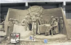  ??  ?? A sand sculpture by David Ducharme, a Canadian artist, of America’s founding fathers during the signing of the Declaratio­n of Independen­ce.