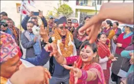  ?? AP ?? Rajan Bhattarai, wearing black cap, leader of Communist Party of Nepal (Unified Marxist–Leninist), dances with supporters as he participat­es in an election campaign in Kathmandu.