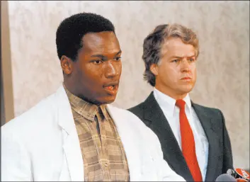  ?? Dave Martin The Associated Press ?? Bo Jackson answers questions in 1987 with attorney Richard Woods after announcing he would play part time for the Raiders in addition to playing with the Royals.