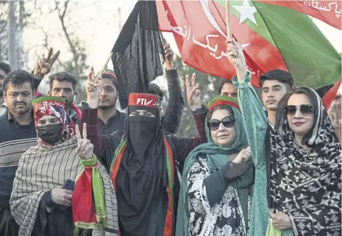  ?? ?? Supporters of Imran Khan, below, and his Pakistan Tehreek-e-insaf party block roads in Peshawar to protest against alleged vote-rigging