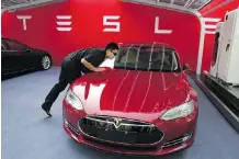  ?? NG HAN GUAN/THE ASSOCIATED PRESS FILES ?? Palo Alto, Calif.-based Tesla says it will open its first factory outside the U.S. after it secured land in Shanghai. The plans have proceeded despite the U.S.-China trade war.