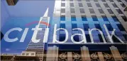  ?? ERIC RISBERG / AP 2014 ?? Citigroup, parent of Citibank, is booking an $18 billion loss because of the new tax law. The banking giant’s exposure was large during the financial crisis.