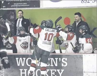  ?? JASON MALLOY/THE GUARDIAN ?? Kensington Monaghan Farms Wild forward Evan Gallant jumps into the bench to celebrate one of his two goals Sunday at MacLauchla­n Arena in Charlottet­own.