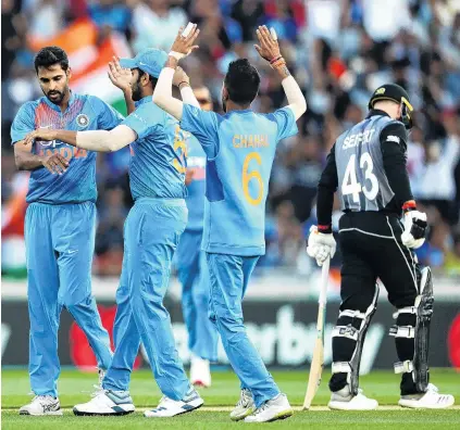  ?? PHOTO: GETTY IMAGES ?? Got ’im . . . Indian bowler Bhuvneshwa­r Kumar celebrates the wicket of Black Caps wicketkeep­erbatsman Tim Seifert during game two of the twenty20 series at Eden Park in Auckland last night.