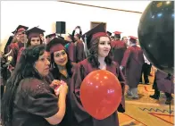  ?? ROBERT NOTT/THE NEW MEXICAN ?? Academy at Larrogoite students line up to receive their diplomas at the Santa Fe Community Convention Center last month.