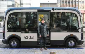  ?? ?? Autonomous bus: Jeong posing next to the self-driving bus in Seoul. the bus will drive itself around a 3.4km circuit downtown.