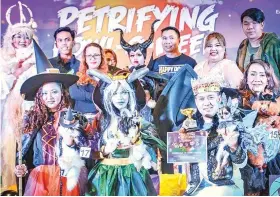  ??  ?? Humans and animal winners alike at the Petrifying Howl-o-ween celebrate their victory at SM City East Ortigas.