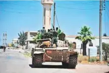  ?? Reuters ?? Regime forces are deployed in Al Ghariya Al Gharbiya in Dara’a province.