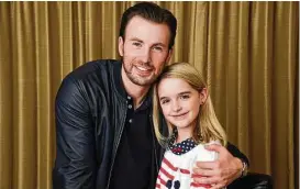  ?? Chris Pizzello / Associated Press ?? “She might as well have an apartment. … I’ve met lesser pros in adults,” Chris Evans says of 10-year-old Mckenna Grace, his costar in “Gifted,” about a man raising his math-prodigy niece. she says. “‘Civil War’ is always (playing) on the plane. And I...