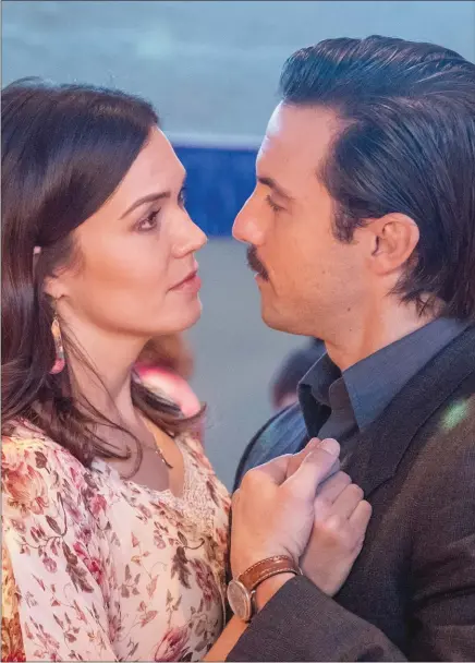  ??  ?? Mandy Moore and Milo Ventimigli­a in a scene from “This Is Us”