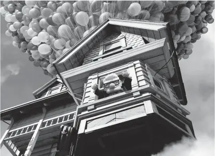  ?? DISNEY/PIXAR ?? Carl Fredrickse­n (voiced by Ed Asner) sees his house and his dreams take flight in 2009’s “Up.”