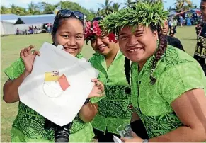  ??  ?? Schoolgirl­s waved Chinese flags during Constituti­on Day celebratio­ns, but the New Zealand flag was noticeably absent from the proceeding­s.