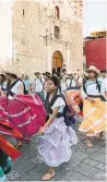  ??  ?? Rows of dancers in colourful skirts swirl past. Oaxaca is famous in Mexico for its many festivals.