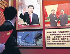  ?? REUTERS ?? A man looks at images of Chinese President Xi Jinping displayed at the Museum of the Communist Party of China in Beijing.