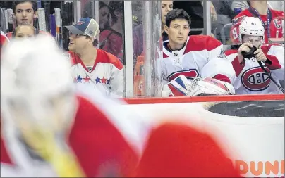  ?? AP PHOTO ?? Montreal Canadiens goalie Carey Price, second from right, sits on the bench during the second period of Saturday’s game against the Washington Capitals.