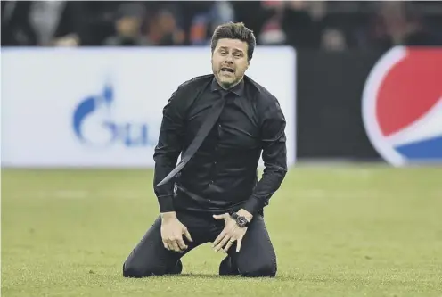  ??  ?? 0 Mauricio Pochettino celebrates on the pitch after Tottenham’s third goal in their remarkable comeback win over Ajax in Amsterdam.